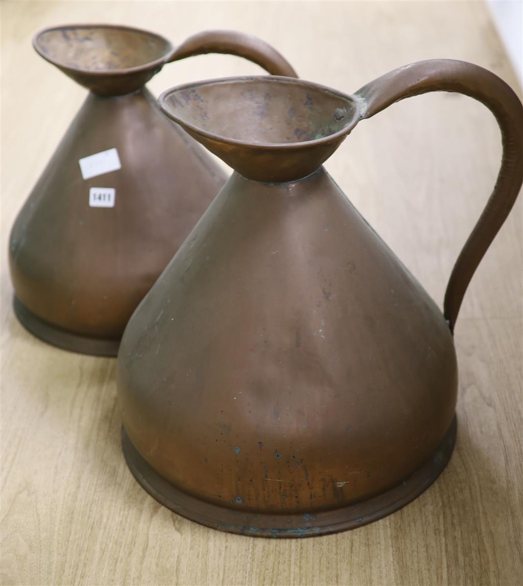 Two graduated copper jugs, one two gallon and other four gallon jugs